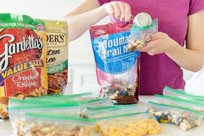 Buy snacks in bulk and individually package them yourself.