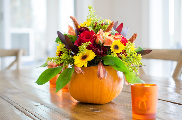 Use a hollowed-out pumpkin as a flower vase.