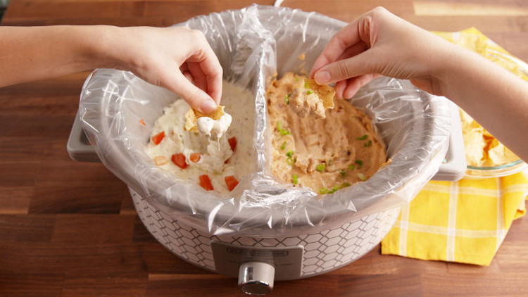 Create a barrier with foil to use one crockpot for two dips.