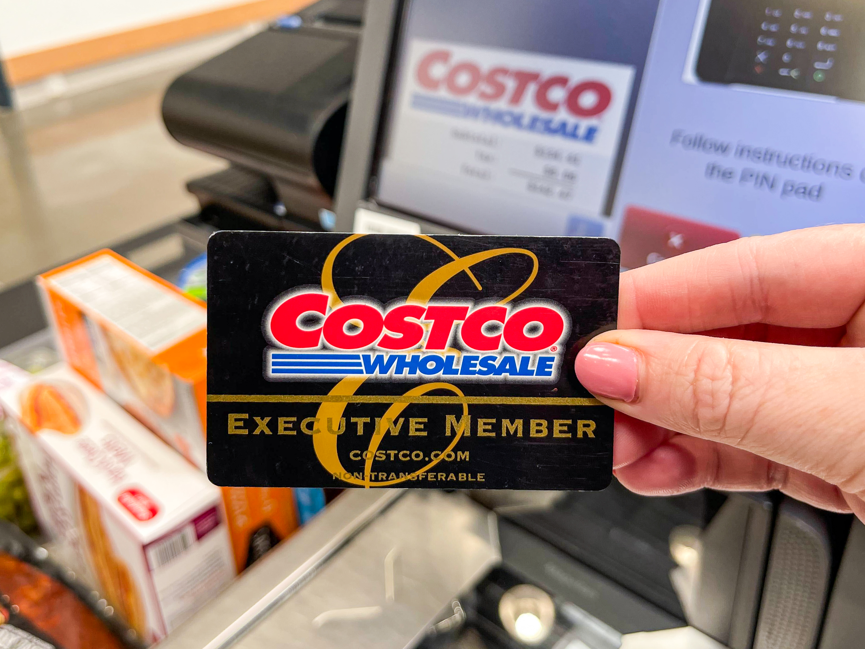 https://prod-cdn.thekrazycouponlady.com/wp-content/uploads/2022/07/costco-membership-member-card-executive-black-card-checkout-groceries-2022-1657640637-1657640637.jpg